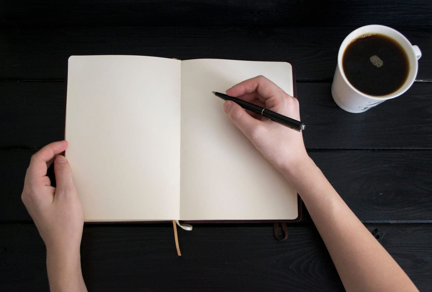 Handwriting in a journal in morning light